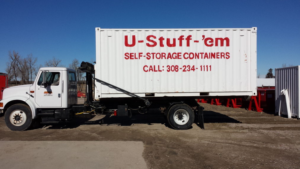 U-Stuff-'em truck delivering a portable self-storage container